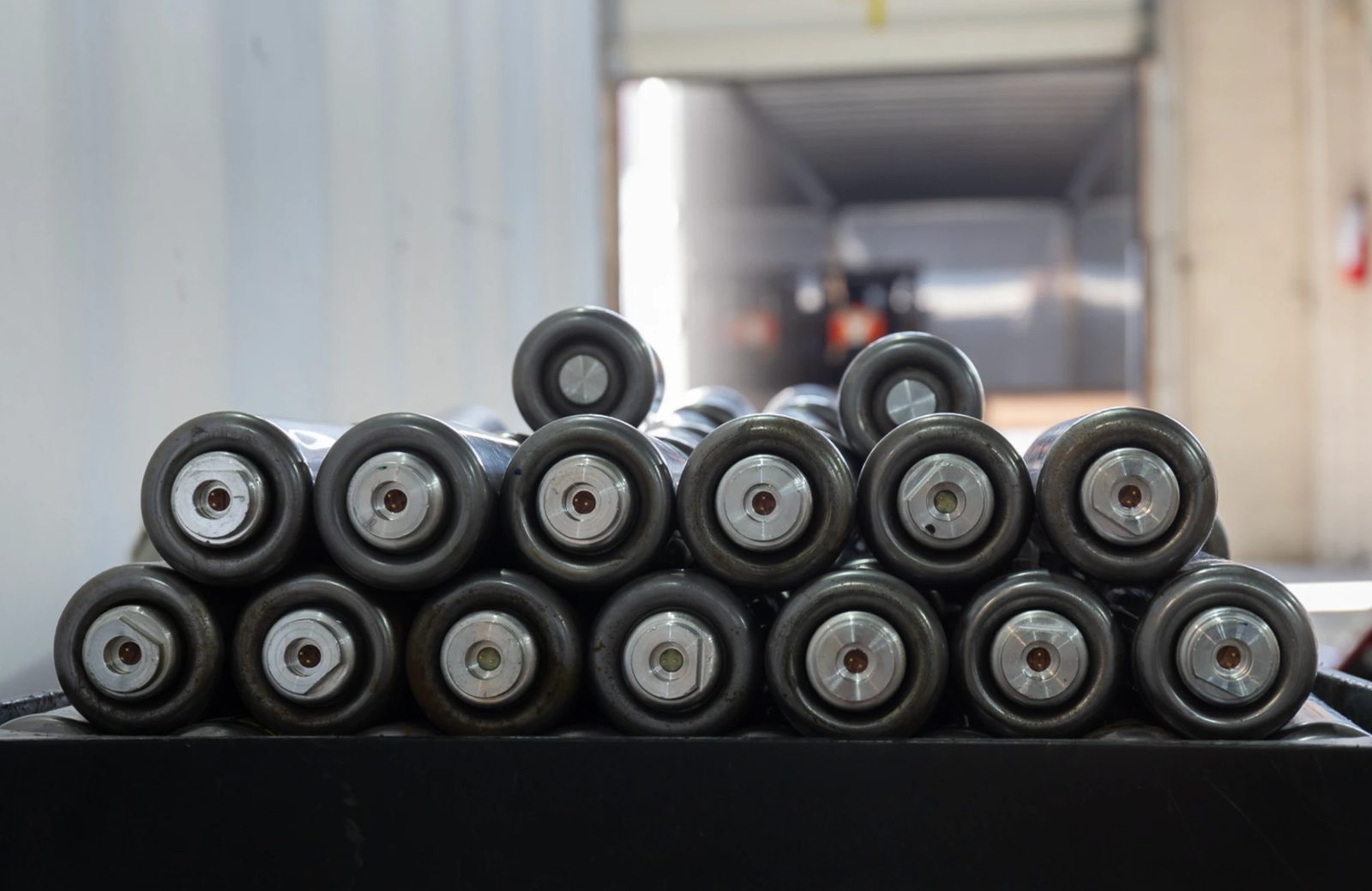 Stacked airbag inflators awaiting secure deactivation