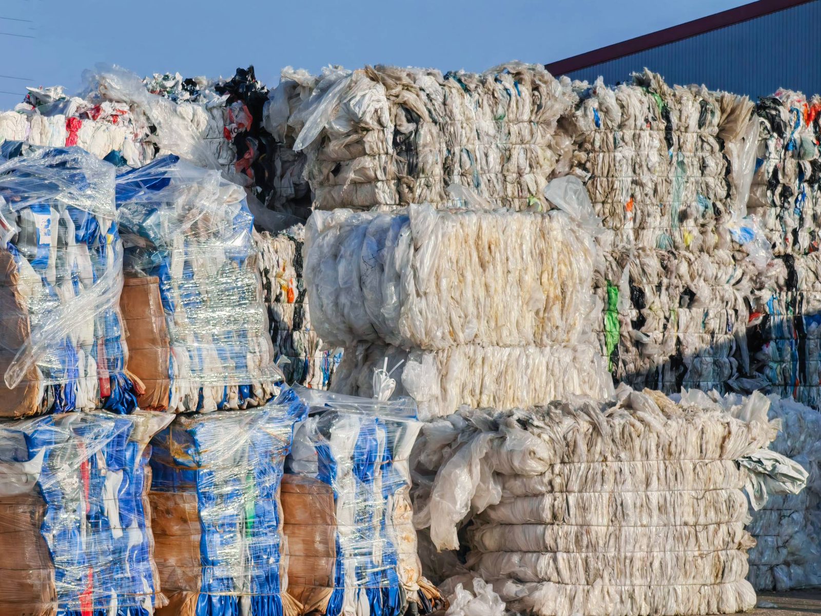 Stacked bales of post-industrial plastic film ready for processing